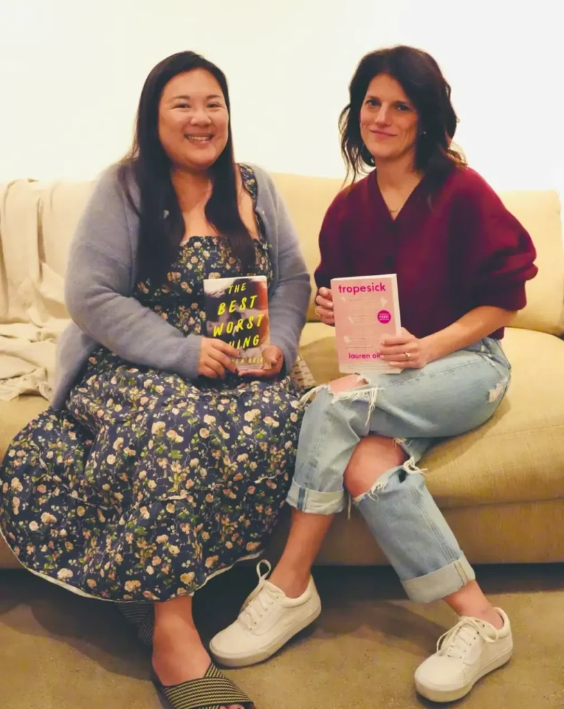 Stephanie Pao holding The Best Worst Thing and author Lauren Okie with her forthcoming novel, Tropesick, at the Hermosa Beach Friends of the Library event, February 2026.